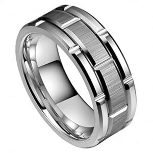 An 8mm silver industrial-style and modern wedding ring featuring a carved pattern design, brushed center, and polished beveled edges and sleeves.