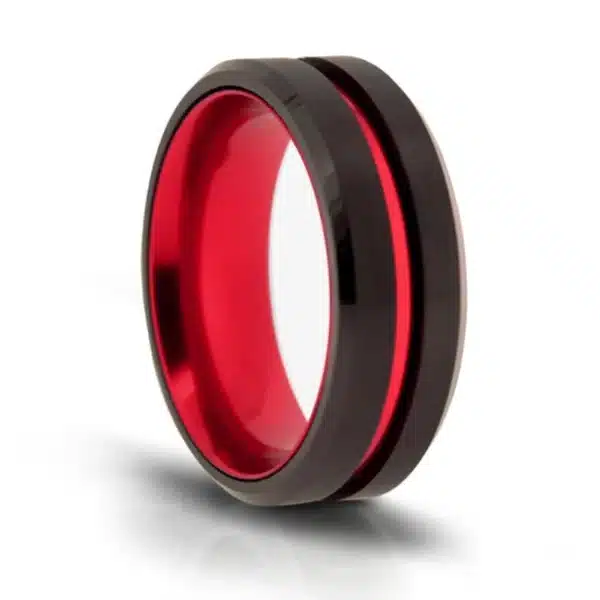 A view of a black tungsten ring and fire engine red stripe and matching red inner band.