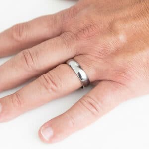 A minimalist and plain 6mm silver tungsten wedding ring with a dome design and polished finish.