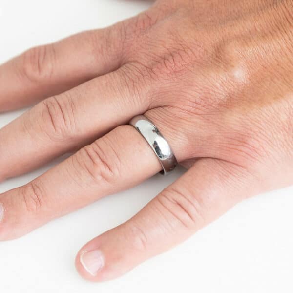 A minimalist and plain 6mm silver tungsten wedding ring with a dome design and polished finish.